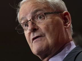 Transport Minister Marc Garneau said the work required to develop new safety standards for transit buses would be complicated.