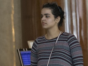 Rahaf Mohammed Alqunun, right, walks with an unidentified companion in Bangkok, Thailand, Friday, Jan. 11, 2019. Alqunun, the 18-year old Saudi woman who fled her family to seek asylum, remains in Thailand under the care of the U.N. refugee agency as she awaits a decision by a third country to accept her as a refugee.