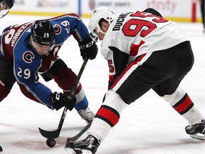 Colorado centre Nathan MacKinnon, left, faces off with Ottawa's Matt Duchene in the first period of a game in Denver on Oct. 26.