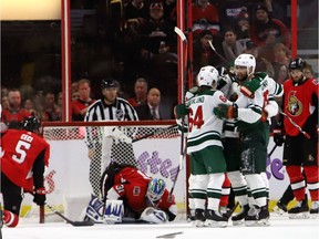 Minnesota Wild players celebrate a goal against the Ottawa Senators during second period NHL hockey action in Ottawa, Saturday, January 5, 2019.