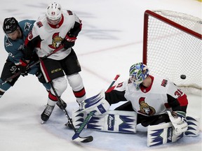 A shot by San Jose Sharks defenceman Brent Burns, not seen, gets past Ottawa Senators goaltender Anders Nilsson.