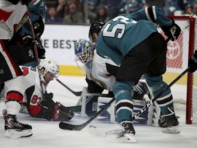 The San Jose Sharks' Lukas Radil (52) has a shot blocked by Ottawa Senators goaltender Anders Nilsson during the first period on Saturday, Jan. 12, 2019.