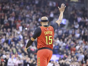 Hawks forward Vince Carter waves to the crowd in Toronto after during Tuesday's game against the Raptors.