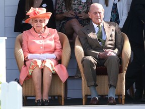 The Queen and Prince Philip, Duke of Edinburgh, sit together at an event in June 2018.