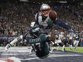 Patriots’ Stephon Gilmore (top) breaks up a pass intended for the Eagles’ Alshon Jeffery. Jeffery, who is a former Bear, is ready for the “terrible” Chicago field and to hear boos from the fans when the teams meet on Sunday.   Matt Slocum/The Associated Press
