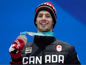 Canada's silver medallist Max Parrot poses on the podium during the medal ceremony for the snowboard Men's Slopestyle at the Pyeongchang Medals Plaza during the Pyeongchang 2018 Winter Olympic Games in Pyeongchang on February 11, 2018.