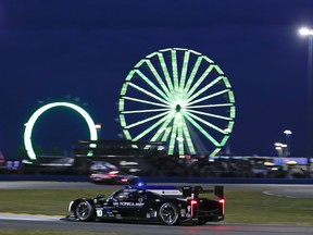 Fernando Alonso drives his Cadillac DPi during 24 Hours of Daytona at Daytona International Speedway on Saturday.  (AP)