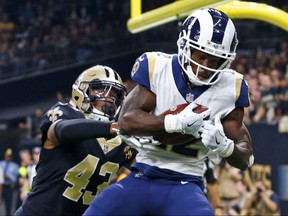 In this Nov. 4, 2018, file photo, Los Angeles Rams wide receiver Brandin Cooks, right, pulls in a touchdown reception in front of New Orleans Saints free safety Marcus Williams in the first half of an NFL football game in New Orleans.  (AP Photo/Butch Dill, File)