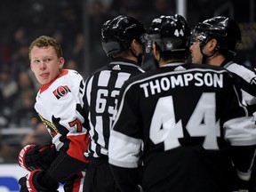 Senators’ Brady Tkachuk (left) stirs things up after a holding penalty to Kings’ Drew Doughty on Thursday night in Los Angeles. Tkachuk and Doughty were getting into it all game, but the Sens forward said it was just healthy competition. (GETTY IMAGES)