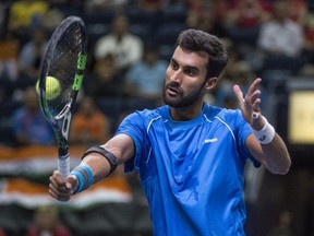 Brayden Schnur of Canada and Yuki Bhambri of India in Davis Cup singles play at the Northlands Coliseum in Edmonton on September 16, 2017.