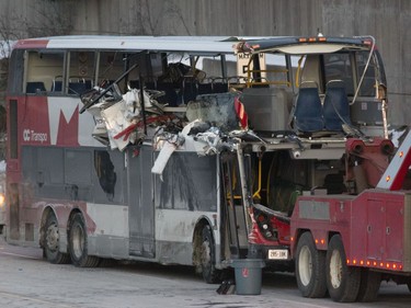 The OC Transpo bus involved in Friday's crash at Westboro Station was towed from the scene, revealing extensive damage, on Jan. 12, 2019.