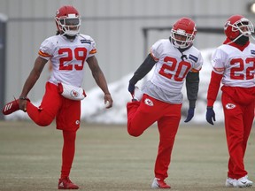 Left to right: Kansas City Chiefs defensive back Eric Berry, cornerback Steven Nelson and defensive back Orlando Scandrick  stretch during workouts Friday in Kansas City, Mo. The Chiefs host the New England Patriots on Sunday. (AP)