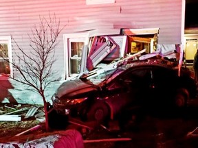 Woman charged with impaired driving after car strikes home on Wolfe Island near Kingston.