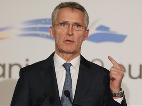 NATO Secretary-General Jens Stoltenberg gestures during media statements in Bucharest, Romania, Wednesday, Jan. 30, 2019.