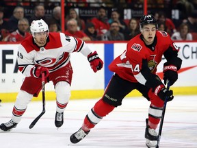 Senators’ Jean Gabriel Pageau (right) moves the puck ahead of Carolina Hurricanes’ Victor Rask on Sunday. Pageau was expected to see an increase in ice time on Wednesday night in Anaheim. (THE CANADIAN PRESS)