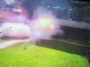 In this image made from security camera video footage, a man blows himself up in a grassy area at the DusitD2, a luxury hotel and shopping complex in Nairobi, Kenya, Tuesday, Jan. 15, 2019. At least five militants attacked the complex in Kenya's capital.