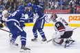 Maple Leafs forwards Auston Matthews (left) and Mitch Marner can't get the puck past Arizona Coyotes goaltender Darcy Kuemper on Sunday night in Toronto. (Chris Young/The Canadian Press)