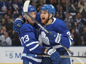 Leafs forward William Nylander (right) celebrates his first goal of the season with defenceman Travis Dermott against the Wild during the Next Generation NHL game at Scotiabank Arena in Toronto on Thursday, Jan. 3, 2019.
