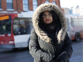 Shamsia Quraishi, a survivor of the OC Transpo-Via Rail crash in September 2013, photographed next to a bus stop on Bank St. in 2014.