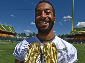 Nate Behar (11) holding his golden soled shoes during the Eskimos practice at Commonwealth Stadium in Edmonton, June 28, 2018.