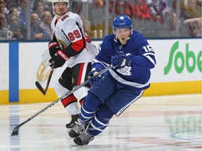 Senators forward Mikkel Boedker keeps an eye on the Leafs' Mitchell Marner during an Oct. 6 game in Toronto. Boedker will miss Wednesday's rematch because he's "week to week" with an unspecified injury.