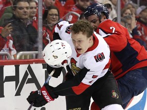 Senators’ Brady Tkachuk is checked by the Capitals Matt Niskanen in Washington last night.  Getty Images