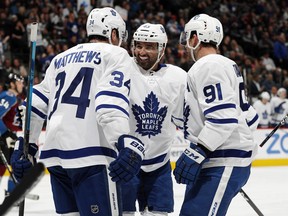 Toronto Maple Leafs centre Nazem Kadri (centre) celebrates one of his two goals against the Colorado Avalanche on Tuesday night. (AP PHOTO)