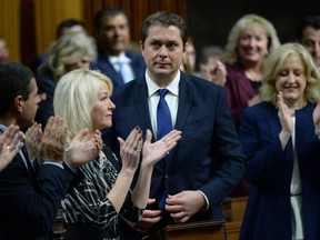 Conservative Leader Andrew Scheer receives applause from members of his caucus during question period on Feb. 19, 2019. (The Canadian Press)