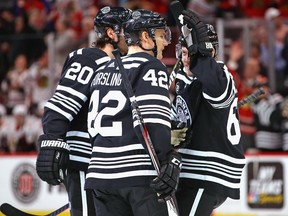 Chicago Blackhawks' Gustav Forsling (centre) celebrates a goal during Monday's game against Ottawa. (GETTY IMAGES)