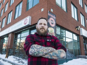 Hintonburger founder Tom Williams poses for a photo outside of his Wellington Street location on February 11, 2019.