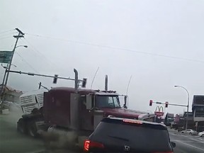 Dash-cam footage shows a truck about to roll over and hit the black Honda Pilot after losing control travelling south on Sumas Way on Feb. 10, 2019.