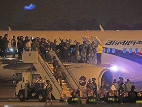 Bangladeshi security personnel stand guard near a Dubai-bound Bangladesh Biman plane on the tarmac of the Shah Amanat International Airport in Chittagong on February 24, 2019, following an emergency landing after a man apparently attempted to hijack the aircraft(STR/AFP/Getty Images)