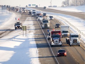 The "United We Roll" convoy of semi-trucks travels the highway near Red Deer, Alta., on Thursday, Feb. 14, 2019, on its way to Ottawa to draw attention to lack of support for the energy sector and lack of pipelines.