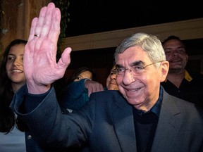 Former Costa Rican president and Nobel Peace Prize winner Oscar Arias gestures to Venezuelan residents in Costa Rica gathered outside his house in San Jose, Costa Rica, Jan. 23, 2019, to thank him for his position against the government of Nicolas Maduro.