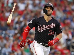 Bryce Harper of the Washington Nationals tosses his bat after flying out against the New York Mets at Nationals Park on July 31, 2018 in Washington, DC. (Patrick Smith/Getty Images)