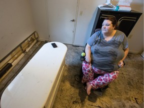 Marie Trudel lives in an OCH unit where a hot-water radiator, seen here on the left behind her dresser, burst in late January, spilling hot black water and steam all over the place. So she had to vacate while the unit is being cleaned up.