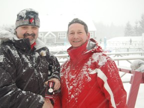 Roger Archambault (left) who received the Queen Elizabeth II Diamond Jubilee Medal from Courcelette Biathlon Club president Francois Pineault, is the chef de mission for the Canadian team to the 2019 FISU Winter Universiade. The Games begin March 2-12 in Krasnoyarsk, Siberia.  Donald Villeneuve/photo