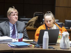 In this Tuesday, Feb. 5, 2019 photo, Traci Tyler sits with attorney Ted Fisher during her trial at the Hardin County Courthouse in Eldora, Iowa. (Zach Boyden-Holmes/The Des Moines Register via AP)