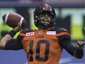 BC Lions quarterback Jonathon Jennings (10) prepares to make a throw during the first half of CFL football action against the Edmonton Eskimos, in Vancouver on Saturday, Oct. 22, 2016.