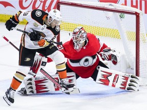 Anaheim Ducks left-winger Brian Gibbons (23) misses a deflection attempt as Ottawa Senators goaltender Anders Nilsson (31) makes a save during the third period at the CTC on Thursday, Feb 7, 2019.