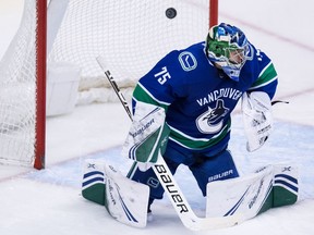 Michael DiPietro allows a goal on a shot by the Sharks' Evander Kane during his NHL regular-season debut with the Canucks on Monday night.