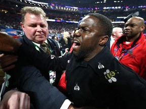 Actor and comedian Kevin Hart celebrates the New England Patriots 13-3 win over the Los Angeles Rams during Super Bowl LIII at Mercedes-Benz Stadium in Atlanta on Sunday, Feb. 3, 2019.