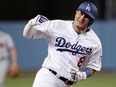 In this Oct. 5, 2018, file photo, then-Los Angeles Dodgers' Manny Machado celebrates his two-run home run against the Atlanta Braves during the first inning of Game 2 of a baseball National League Division Series, in Los Angeles.