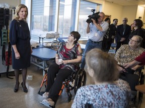 Christine Elliott, deputy premier and minister of Health and Long-Term Care, greets patients at Bridgepoint Active Healthcare before making an announcement in Toronto on Tuesday, Feb. 26, 2019.