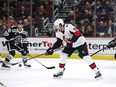 Ottawa Senators right wing Bobby Ryan knocks the puck out of the air as Chicago Blackhawks defenseman Connor Murphy defends Monday in Chicago.