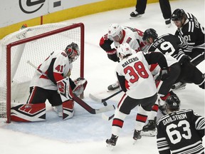 Chicago Blackhawks center Jonathan Toews tries to get the puck past Ottawa Senators goaltender Craig Anderson on Monday, Feb. 18, 2019.