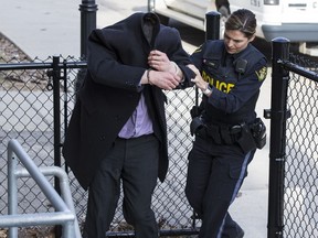 Ryan Hartman is escorted by O.P.P. officers to a holding cell at the Brockville Courthouse after being convicted of the 2011 sexual assault of Bekah D'Aoust. March 20, 2019.