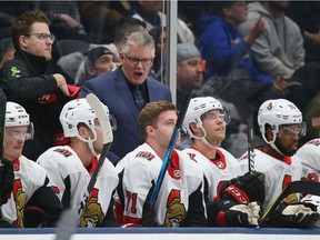 Marc Crawford stands behind the Senators bench as head coach for a March 5 game against the Islanders.