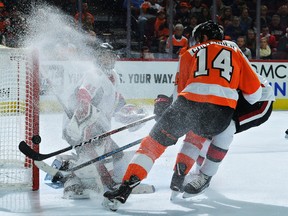 Senators' Craig Anderson  looks back at the puck as it hits off of the goal post on a shot by Flyers' Sean Couturier during Monday's game. (GETTY IMAGES)