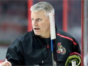 Head coach Marc Crawford talks to Senators players during a practice in Ottawa last week.